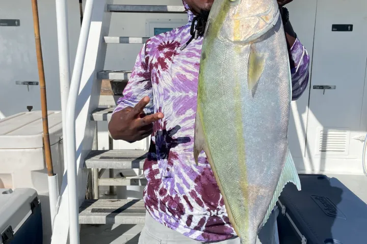 a person holding a fish