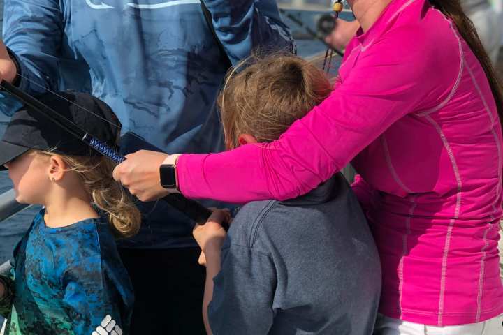 a group of people standing next to a woman