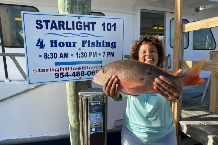 a person holding a fish