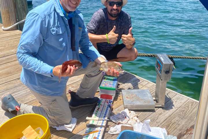 a group of people on a boat in the water