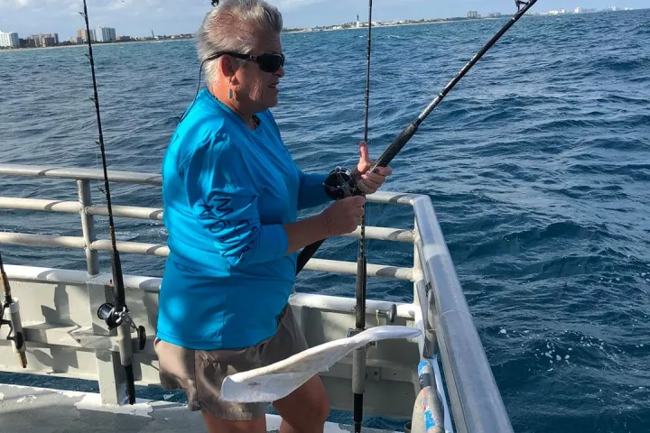 a man riding on the back of a boat
