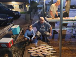 a group of people sitting on a grill