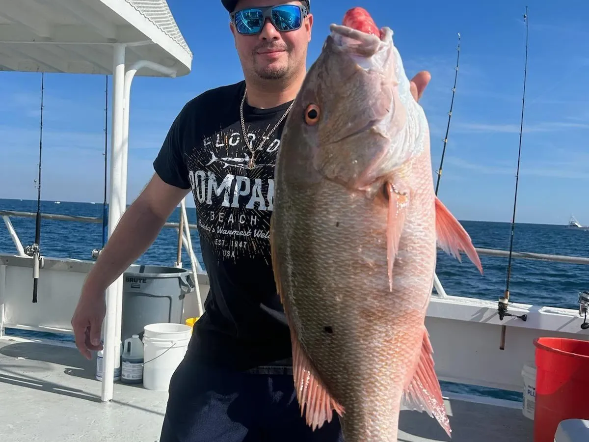 a man holding a fish